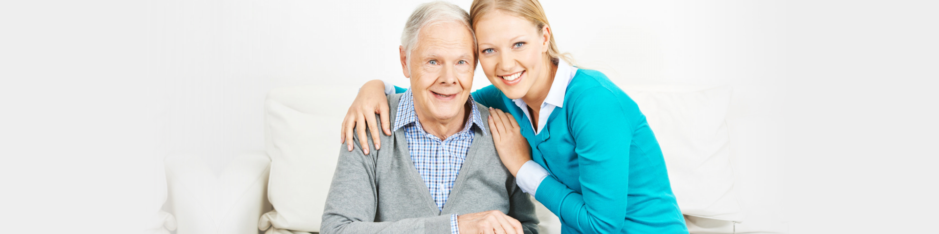 Caregiver and senior smiling